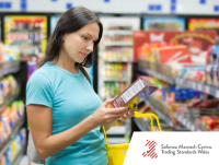 Image of woman reading food label