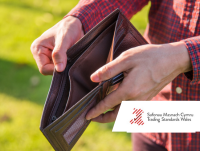 Image of a person holding an empty wallet